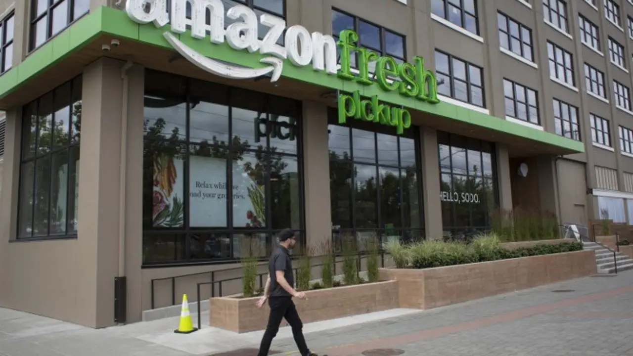 SEATTLE, WA - JUNE 16: A man walks past an AmazonFresh Pickup location on June 16, 2017 in Seattle, Washington. Amazon announced that it will buy Whole Foods Market, Inc. for over $13 billion dollars.   David Ryder/Getty Images/AFP