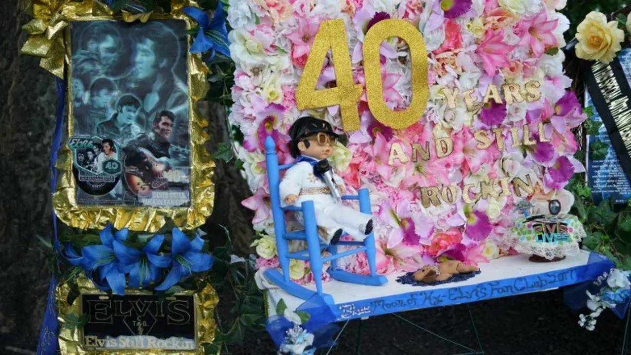 An August 12, 2017 photo shows tributes left by fans near the gravesite of Elvis Presely at his Graceland mansion in Memphis, Tennessee.
Forty years after his tragic death at age 42, more than 600,000 fans visit each year, floral tributes still gather from around the world in the Meditation Garden, where the King of rock 'n' roll his buried at his Graceland home in Memphis. / AFP PHOTO / MANDEL NGAN / With AFP Story by Jennie MATTHEW: 'Gift from God' Elvis the semi-divine myth 40 years on  