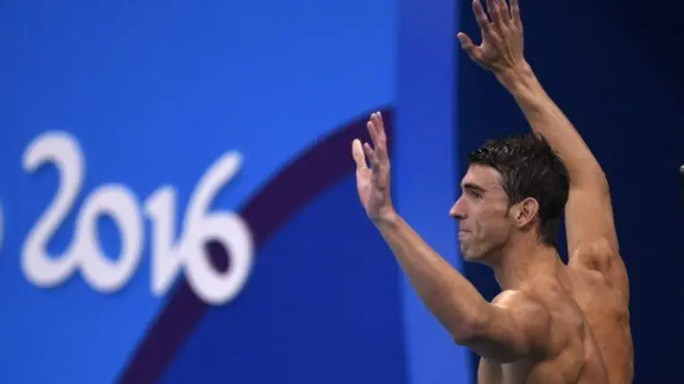 USA's Michael Phelps celebrates after USA won the Men's swimming 4 x 100m Medley Relay Final at the Rio 2016 Olympic Games at the Olympic Aquatics Stadium in Rio de Janeiro on August 13, 2016.   / AFP PHOTO / Martin BUREAU