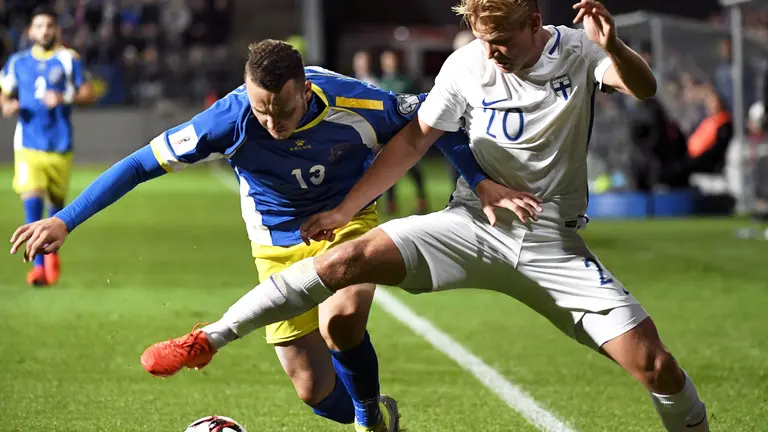 Joel Pohjanpalo of Finland (R) vies with Albert Bunjaku of Kosovo during the World Cup 2018 qualifying football match Finland vs Kosovo on September 5, 2016 in Turku. / AFP PHOTO / Lehtikuva / Jussi Nukari / Finland OUT