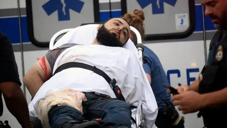 Ahmad Khan Rahami is taken into custody after a shootout with police Monday, Sept. 19, 2016, in Linden, N.J. Rahami was wanted for questioning in the bombings that rocked the Chelsea neighborhood of New York and the New Jersey shore town of Seaside Park. (Nicolaus Czarnecki/Boston Herald via AP) /The Boston Herald via AP)