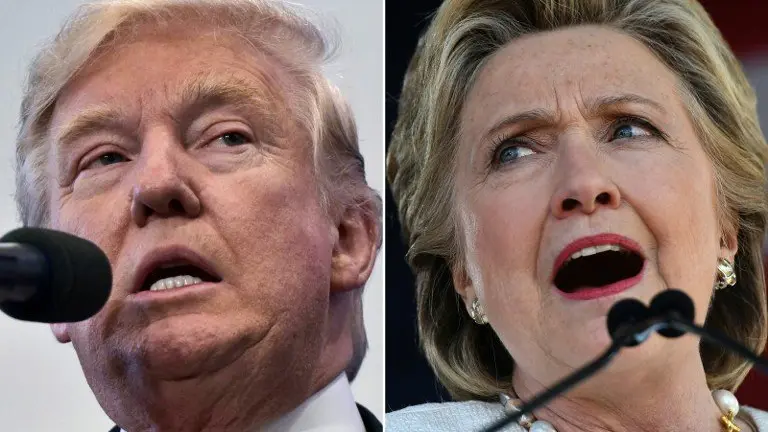 (COMBO) This combination of pictures created on November 04, 2016 shows
US Republican presidential nominee Donald Trump in Atkinson, New Hampshire on November 4, 2016 and US Democratic presidential nominee Hillary Clinton in Dade City, Florida, on November 1, 2016. 

With only 4 days to go until Election Day, Hillary Clinton and Donald Trump were barnstorming battleground states.

 / AFP PHOTO / MANDEL NGAN AND JEWEL SAMAD