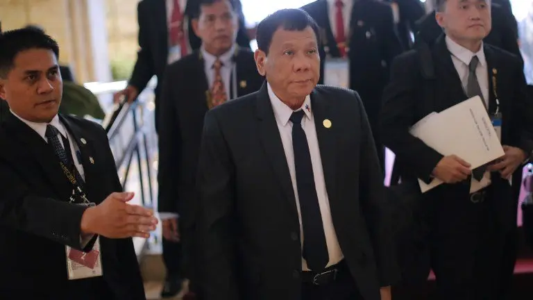 Philippine President Rodrigo Duterte (C) arrives at a hotel to attend a bilateral meeting with Russia's President Vladimir Putin on the sidelines of the Asia-Pacific Economic Cooperation Summit (APEC) in Lima on November 19, 2016. / AFP PHOTO / LUKA GONZALES