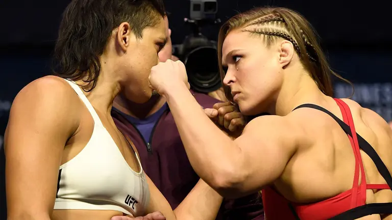 LAS VEGAS, NV - DECEMBER 29:  (L-R) UFC women's bantamweight champion Amanda Nunes of Brazil and Ronda Rousey face off during the UFC 207 weigh-in at T-Mobile Arena on December 29, 2016 in Las Vegas, Nevada. (Photo by Josh Hedges/Zuffa LLC/Zuffa LLC via Getty Images)