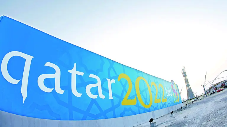 TO GO WITH AFP STORY BY FRANCOISE CHAPTAL
(FILES)  -- File picture dated March 22, 2010 shows a banner for Qatar's 2022 bid to host the World Cup is seen near Aspire athletics zone in Doha. The gulf emirate, future host of the 2022 FIFA World Cup and past playground of several Arab and Asian games, is reaching for the moon as it eyes the 2020 Olympics despite seemingly insurmountable climate challenges.     AFP PHOTO/KARIM JAAFAR