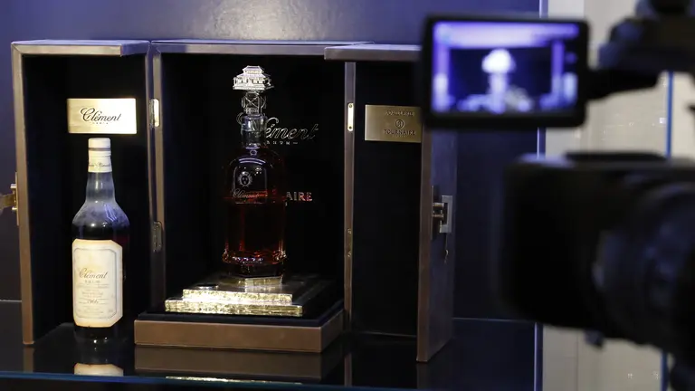 This picture taken on February 21, 2017, shows the world's most expensive rhum bottle sold in auction to raise money for an association fighting sick cells anemia, in Paris on February 21, 2017. / AFP PHOTO / PATRICK KOVARIK