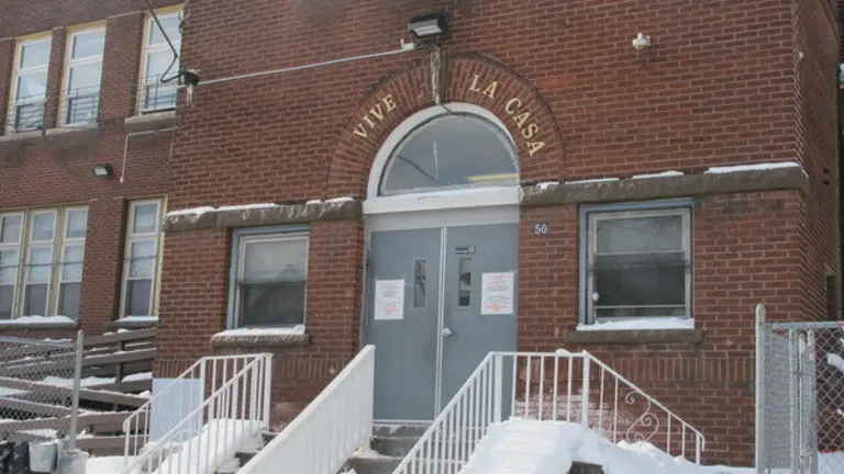 A Jan. 15, 2015 photo shows the exterior of Vive La Casa in Buffalo, N.Y. The shelter, which helps refugees seek asylum in Canada and the United States, announced it is being purchased by fellow Buffalo nonprofit Jericho Road Community Health Center, which will continue the shelter's mission. (AP Photo/Carolyn Thompson)
