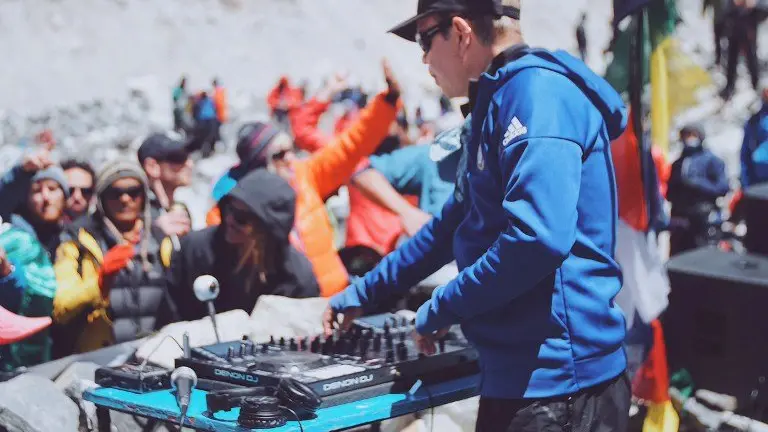 British DJ Paul Oakenfold plays a set to mountaineers and trekkers at Everest base camp on April 11, 2017.
Top British DJ Paul Oakenfold braved thinning air and freezing temperatures to host the "highest party on earth" at Everest base camp on April 11, playing to around 100 climbers -- all in full mountain gear. The 53-year-old artist, who trekked for 10 days to reach base camp, mixed his beats on a makeshift stone stage set against the spectacular backdrop of the world's highest mountains. XGTY / RESTRICTED TO EDITORIAL USE - MANDATORY CREDIT "AFP PHOTO / ANTON NELSON / SOUNDTREK" - NO MARKETING NO ADVERTISING CAMPAIGNS - DISTRIBUTED AS A SERVICE TO CLIENTS / AFP PHOTO / Paul Oakenfold's SoundTrek / Anton NELSON / XGTY / RESTRICTED TO EDITORIAL USE - MANDATORY CREDIT "AFP PHOTO / ANTON NELSON / SOUNDTREK" - NO MARKETING NO ADVERTISING CAMPAIGNS - DISTRIBUTED AS A SERVICE TO CLIENTS
