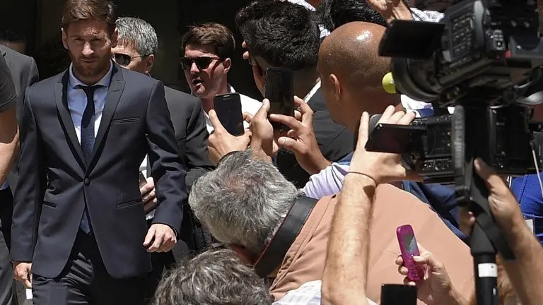 (FILES) This file photo taken on June 2, 2016 shows Barcelona's football star Lionel Messi (L) leaveing the courthouse on June 2, 2016 in Barcelona.
Spain's Supreme Court on May 24, 2017 confirmed a 21-month jail sentence and 2.09-million-euro ($2.25 million) fine imposed on Lionel Messi for tax fraud, months after the Barcelona football star lodged an appeal.
 / AFP PHOTO / LLUIS GENE