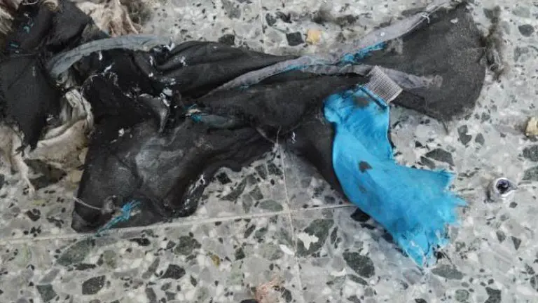 This photo obtained May 24, 2017 courtesy of The New York Times (http://nyti.ms/2rV9VcF) from British Law Enforcement, shows what the bomber in the Manchester terrorist attack appeared to have carried as a powerful explosive in a lightweight metal container concealed within a blue Karrimor backpack, and to have held a small detonator in his left hand, according to preliminary information gathered by British authorities in Manchester, England.
Twenty-two people were killed in Monday's suicide attack on a Manchester pop concert, including an eight-year-old girl and several parents who had come to collect their children. / AFP PHOTO / THE NEW YORK TIMES / Handout / RESTRICTED TO EDITORIAL USE - MANDATORY CREDIT "AFP PHOTO / THE NEW YORK TIMES/HANDOUT" - NO MARKETING NO ADVERTISING CAMPAIGNS - DISTRIBUTED AS A SERVICE TO CLIENTS


