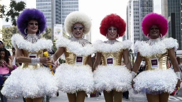 Revelers take part in the 21st Gay Pride Parade, whose theme is "Secular State", in Sao Paulo, Brazil on June 18, 2017.  / AFP PHOTO / Miguel SCHINCARIOL
