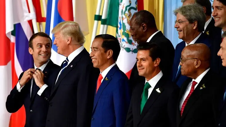(1st row L-R) French President Emmanuel Macron, US President Donald Trump, Indonesia's President Joko Widodo, Mexico's President Enrique Pena Nieto, South Africa's President Jacob Zuma pose for a family photo of the participants of the G20 summit in Hamburg, northern Germany on July 7, 2017.
Leaders of the world's top economies gather from July 7 to 8, 2017 in Germany for likely the stormiest G20 summit in years, with disagreements ranging from wars to climate change and global trade. / AFP PHOTO / Tobias SCHWARZ