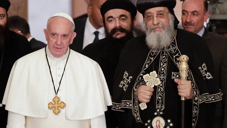 Pope Francis, left, is flanked by Pope Tawadros II, spiritual leader of Egypt's Orthodox Christians, 2nd from right, at Cairo's St. Mark's Cathedral, Friday, April 28, 2017. Francis is in Egypt for a two-day trip aimed at presenting a united Christian-Muslim front that repudiates violence committed in God's name. (AP Photo/Gregorio Borgia)