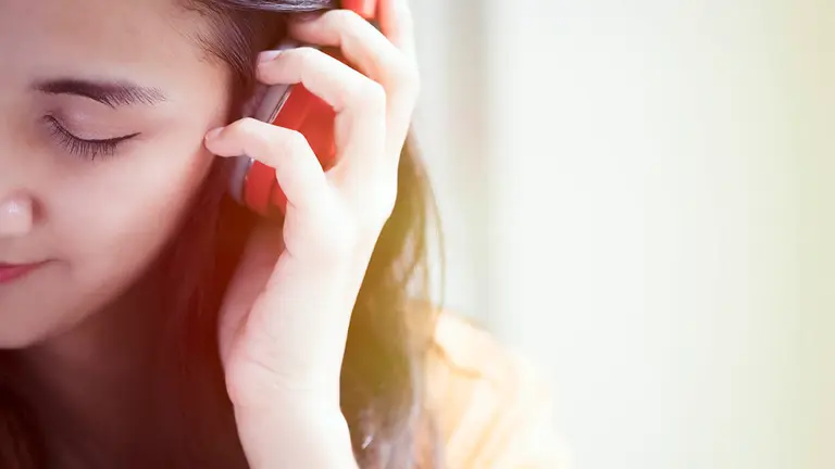 Young beautiful woman enjoying the music. Hobby and relax concept idea background.