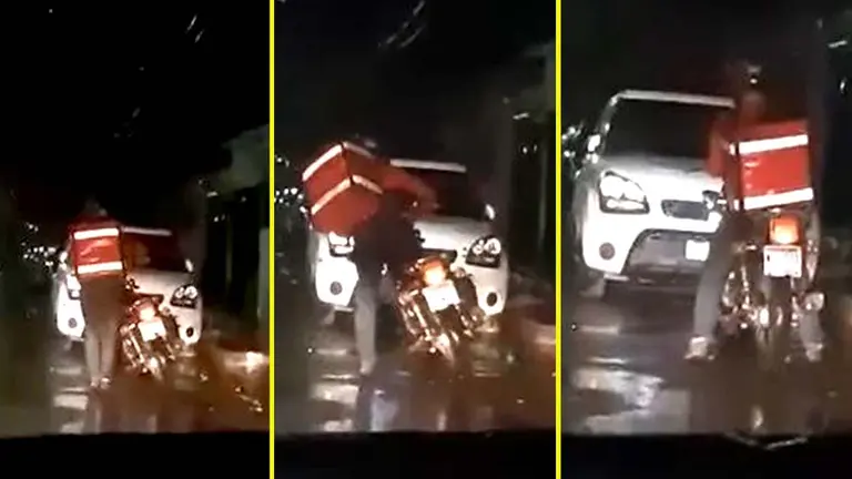 Motociclista delivery bajo la lluvia 3 Foto tomada de Motociclistas de El Salvador