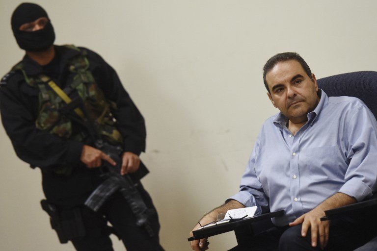 Former Salvadoran President (2004-2009), Elias Antonio Saca, attends a hearing at the Isidro Menendez Judicial Centre in San Salvador, on November 4, 2016. 
Saca, arrested alongside six other people over the past weekend, was accused by the Salvadorean public prosecutor's office of diverting $246 million dollars from state coffers. / AFP PHOTO / Marvin RECINOS