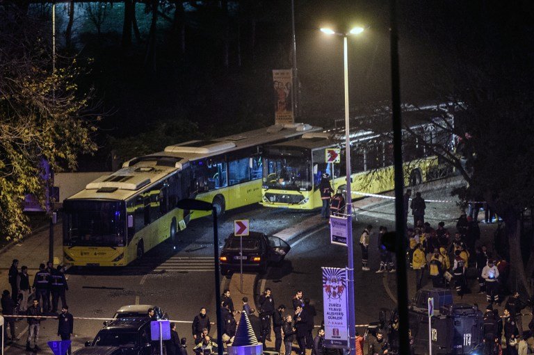 Turkish emergency workers, police officers and forensic work on the site where a car bomb exploded near the stadium of football club Besiktas in central Istanbul on December 10, 2016.  

The car bomb exploded in the heart of Istanbul on late December 10, wounding around 20 police officers, Turkey's interior minister said, quoted by the official Anadolu news agency. The bomb, apparently targeting a bus carrying police officers, exploded outside the stadium of Istanbul football club Besiktas following its match against Bursaspor.
 / AFP PHOTO / OZAN KOSE