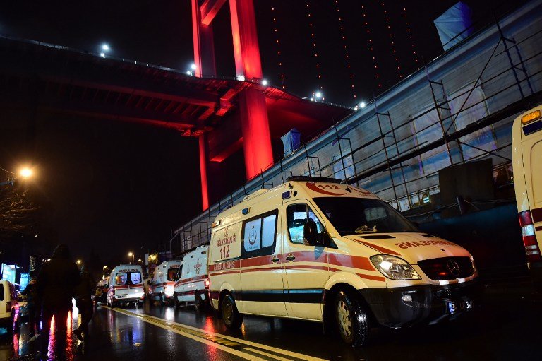 Ambulances are seen at the site of an armed attack January 1, 2017 in Istanbul. 
At least two people were killed in an armed attack Saturday on an Istanbul nightclub where people were celebrating the New Year, Turkish television reports said. / AFP PHOTO / YASIN AKGUL
