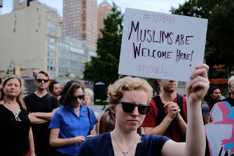 NEW YORK, NY - JUNE 29: Recent Immingrants join activists for an evening protest in Manhattan hours before a revised version of President Donald Trump's travel ban that was approved by the Supreme Court is to take effect on June 29, 2017 in New York City. Hundreds of protesters marched through the streets demanding and end to the ban which prohibits for 90 days the entry of travellers from six predominantly Muslim countries: Iran, Libya, Somalia, Sudan, Syria and Yemen. The court granted an exception for people with 'bona fide relationships' in the United States. Spencer Platt/Getty Images/AFP