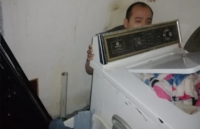 Escondido en detrás de la Lavadora